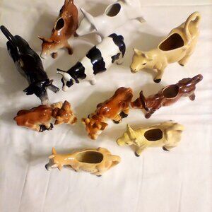 Vintage cows and cow creamers